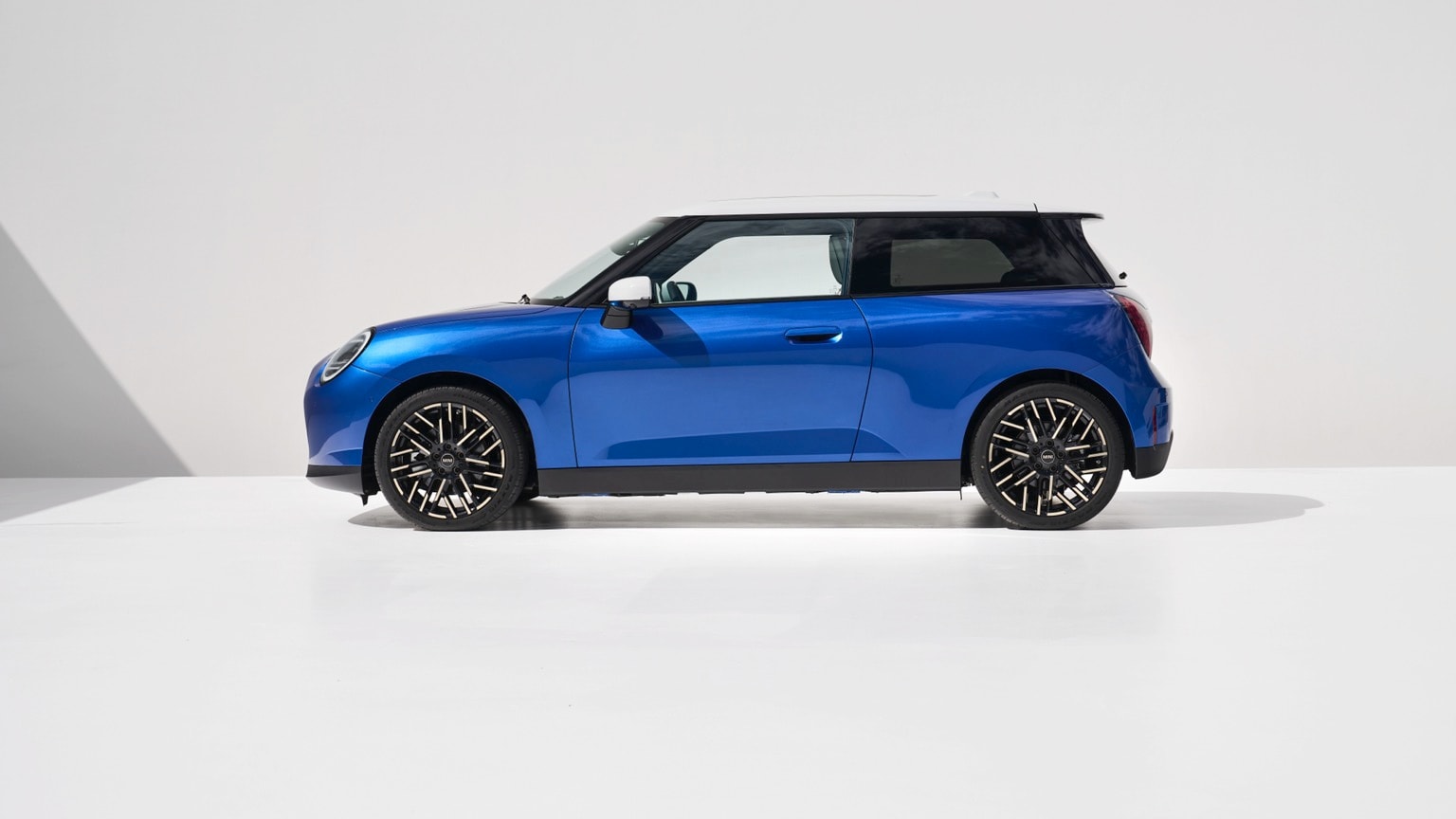 a blue car with black rims