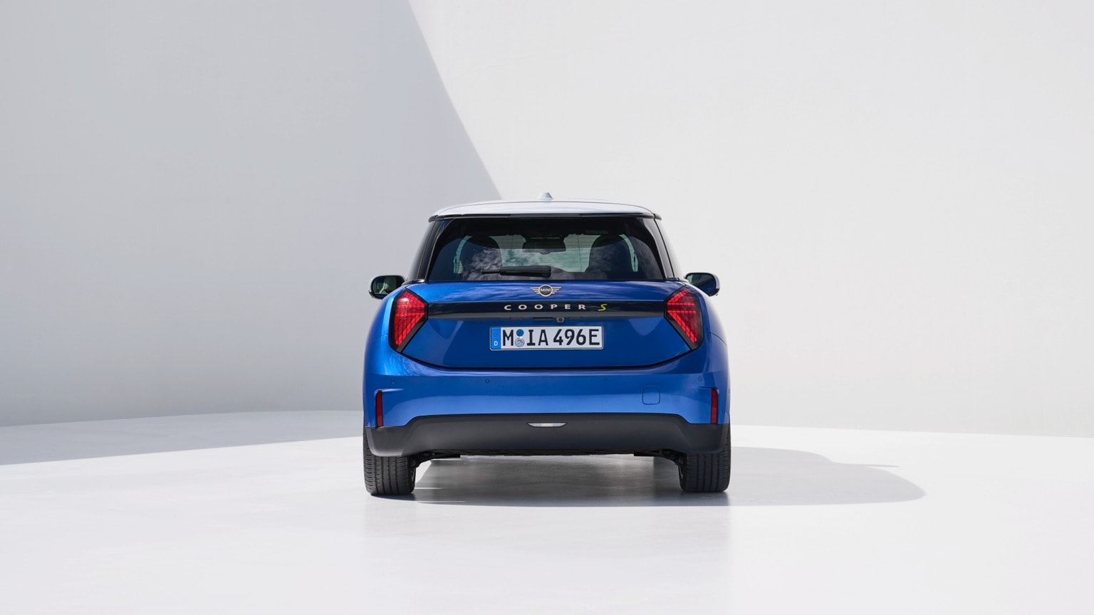 a blue car parked in a room
