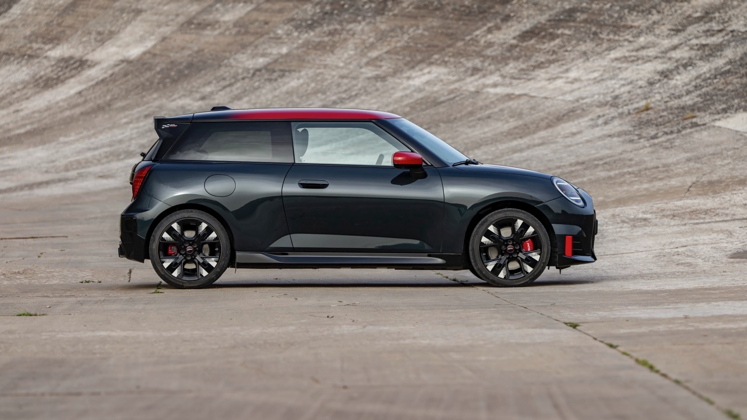 a black car parked on a concrete surface