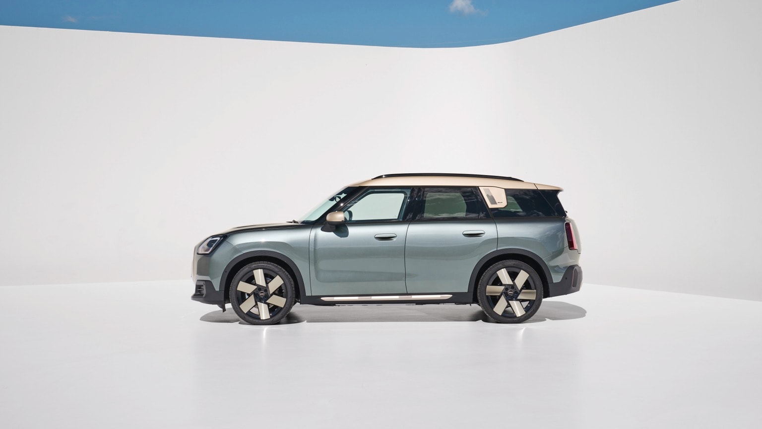 a car parked in a white room