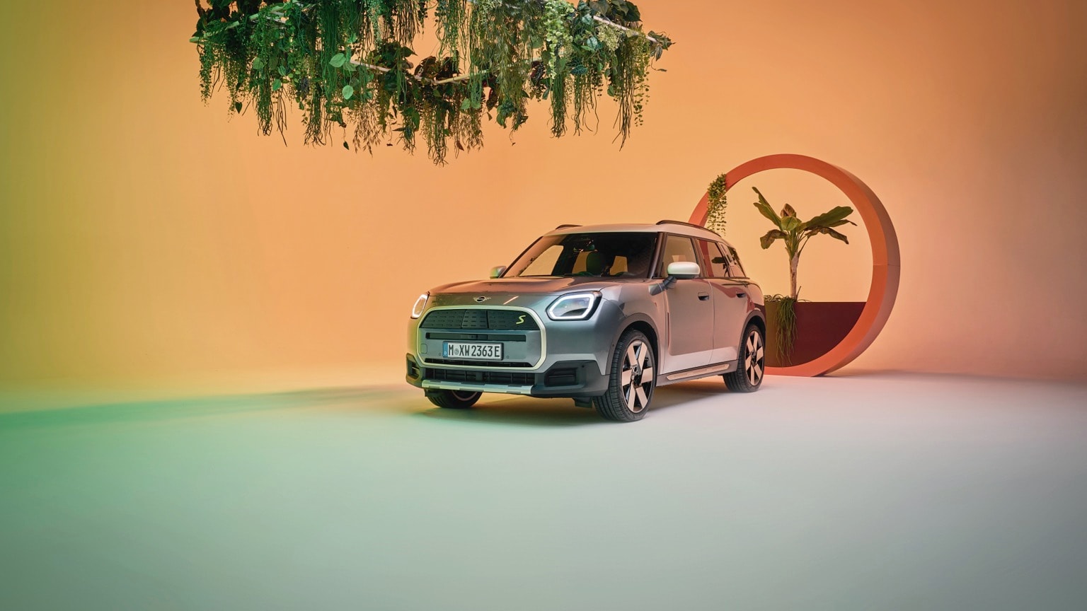 a car parked in front of a planter