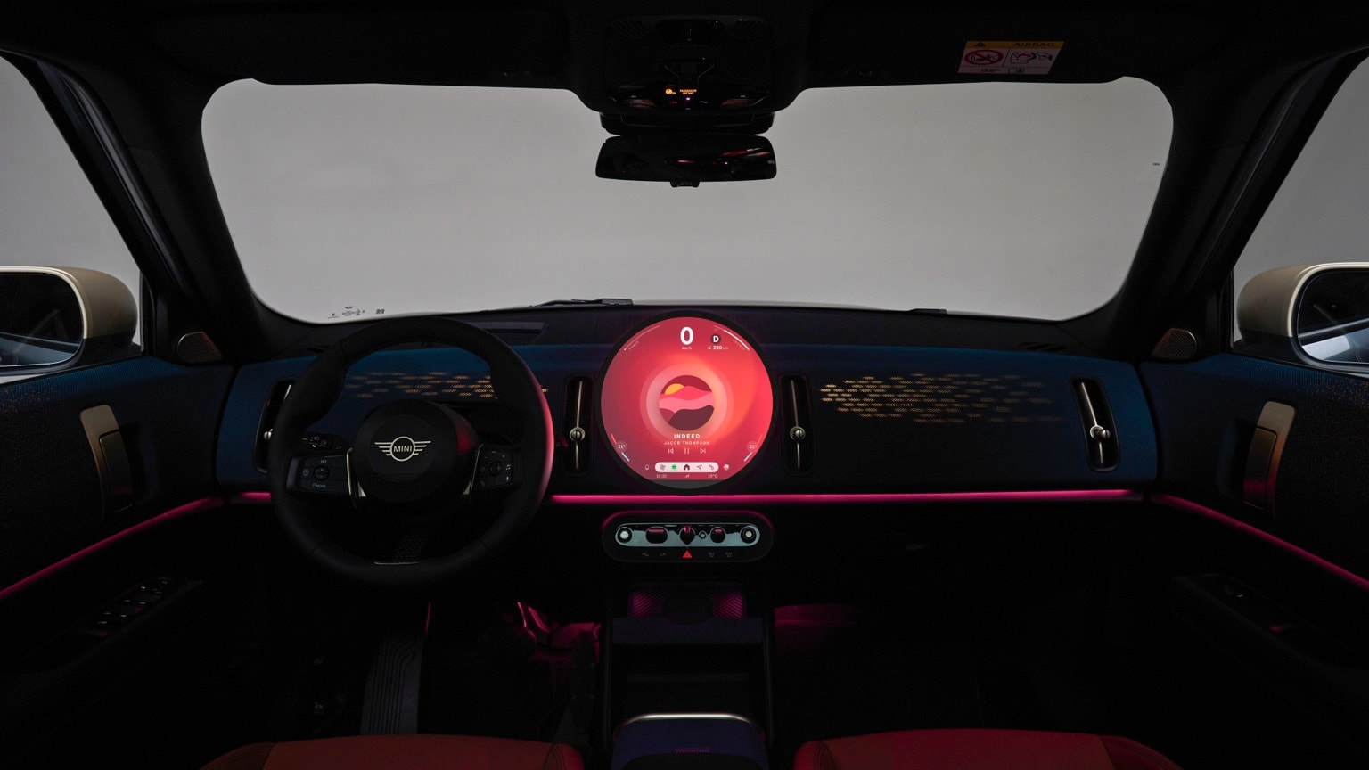 the interior of a car with a dashboard and steering wheel