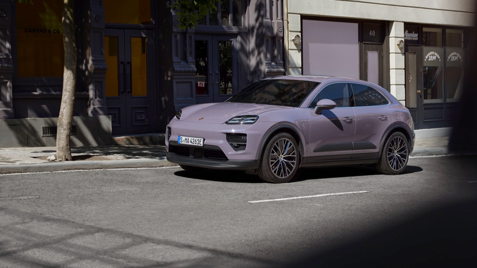 a purple car parked on the side of a road