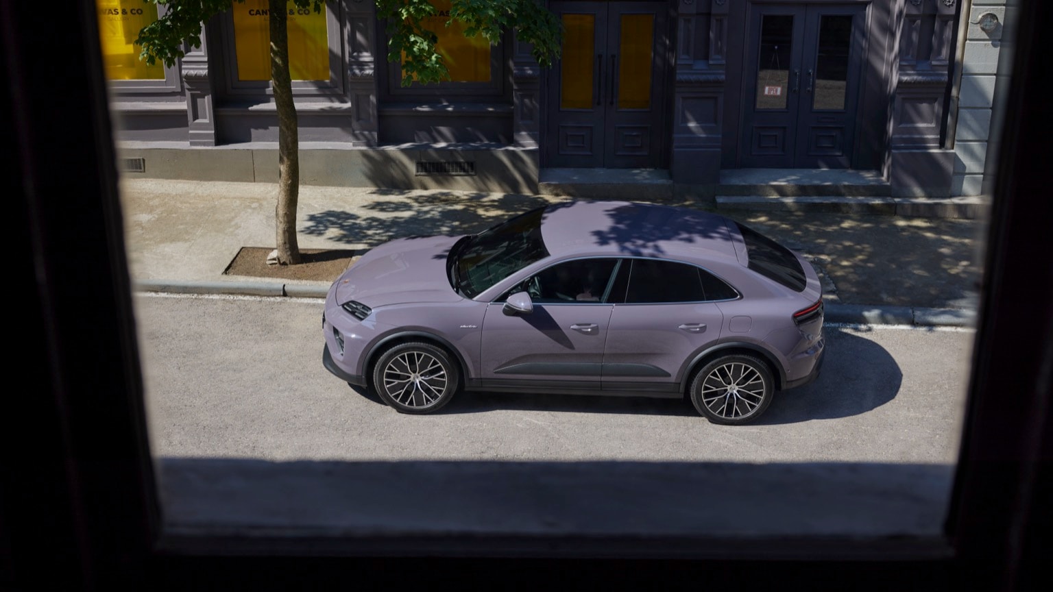 a purple car parked on the side of a road