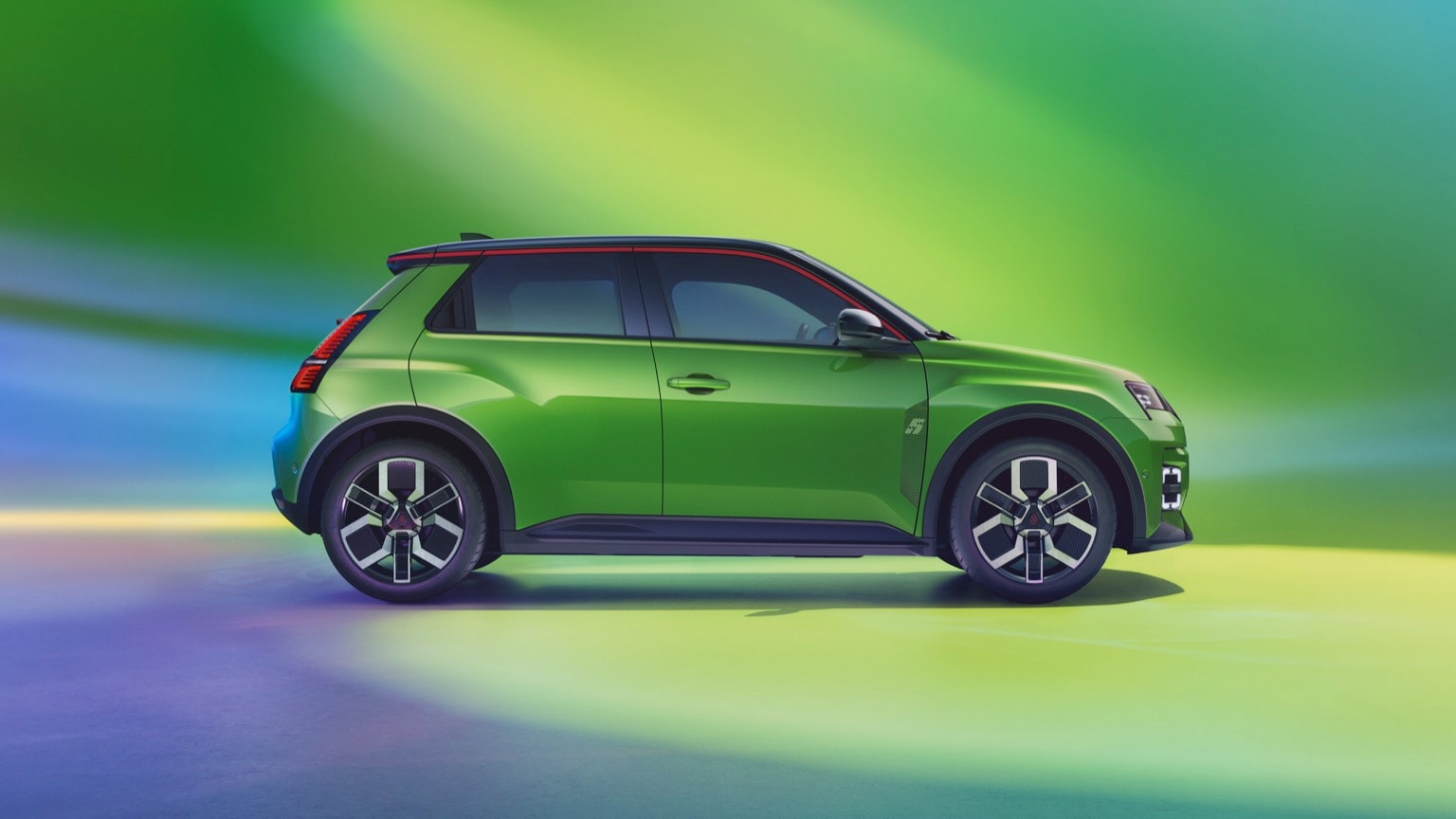 a green car parked on a reflective surface