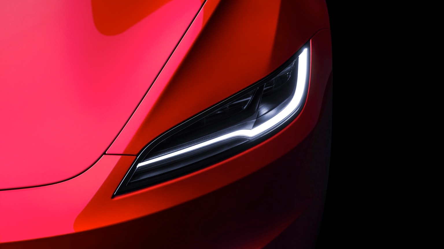 the headlight of a red car