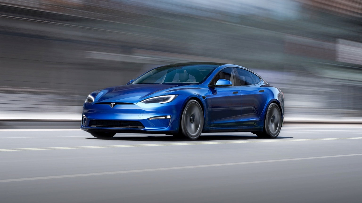 a blue car on a road